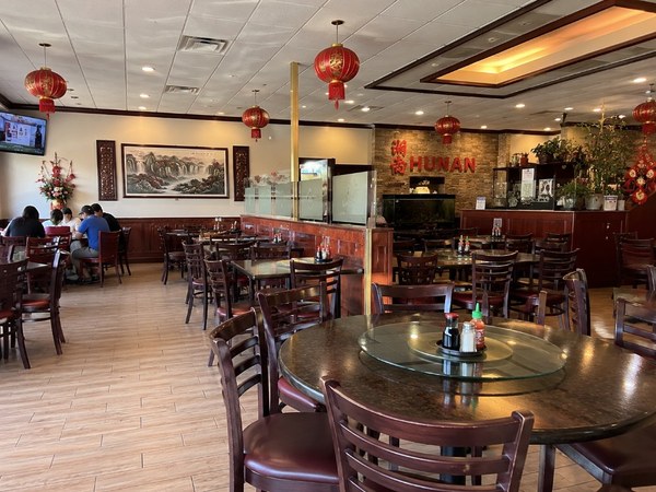 Hunan Restaurant dining room with traditional Chinese decor and red lanterns